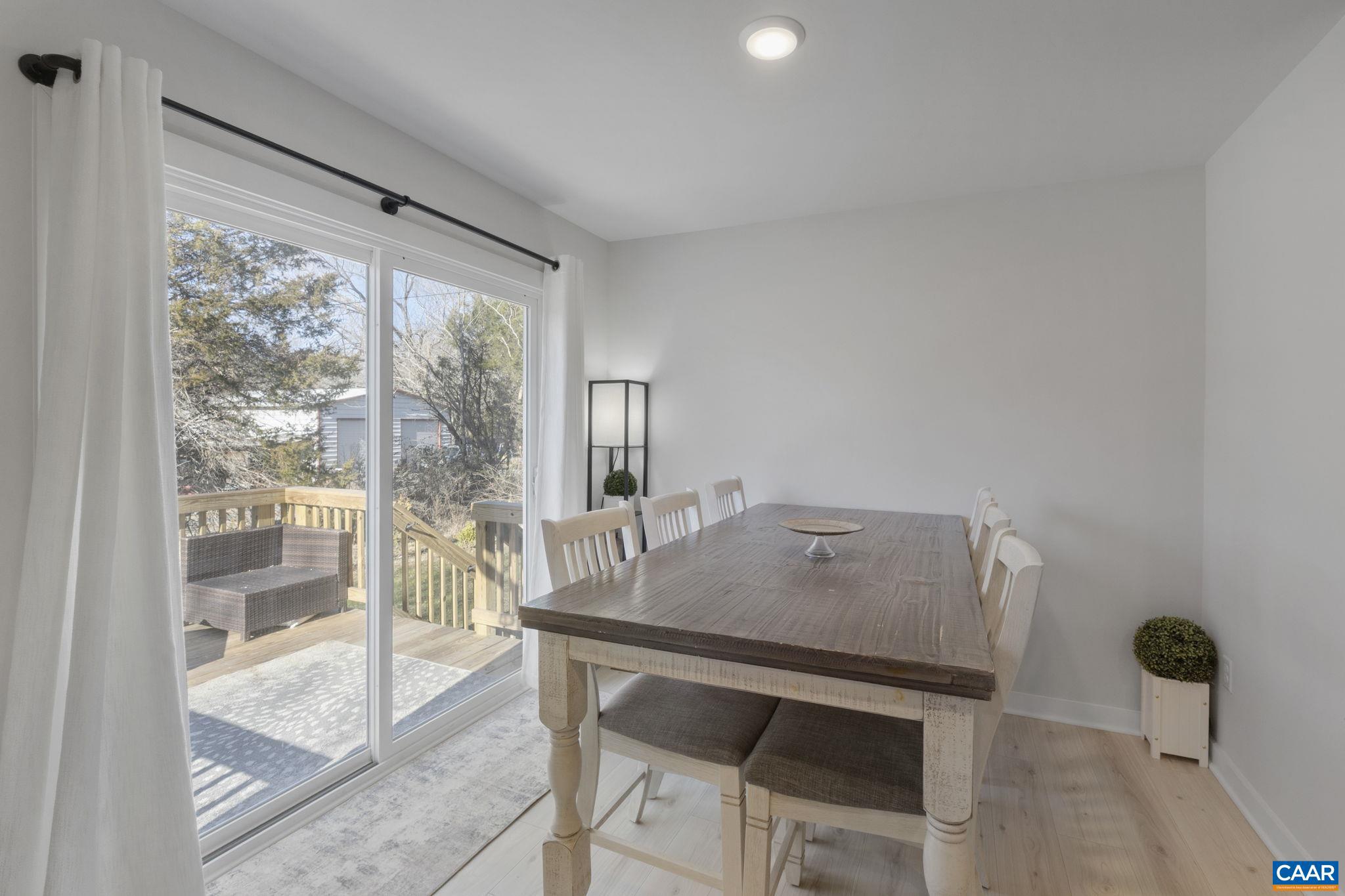 7440 Louisa Road Gordonsville, VA 22942 - Photo 19 of 40 a view of a dining room with furniture and wooden floor