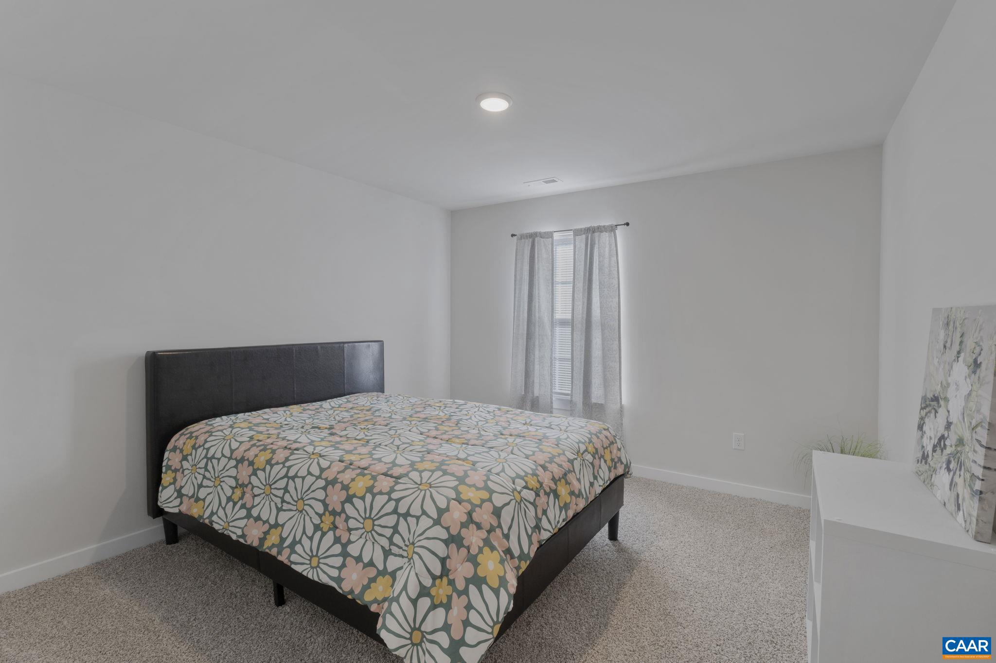 7440 Louisa Road Gordonsville, VA 22942 - Photo 28 of 40 a bedroom with a bed and a window