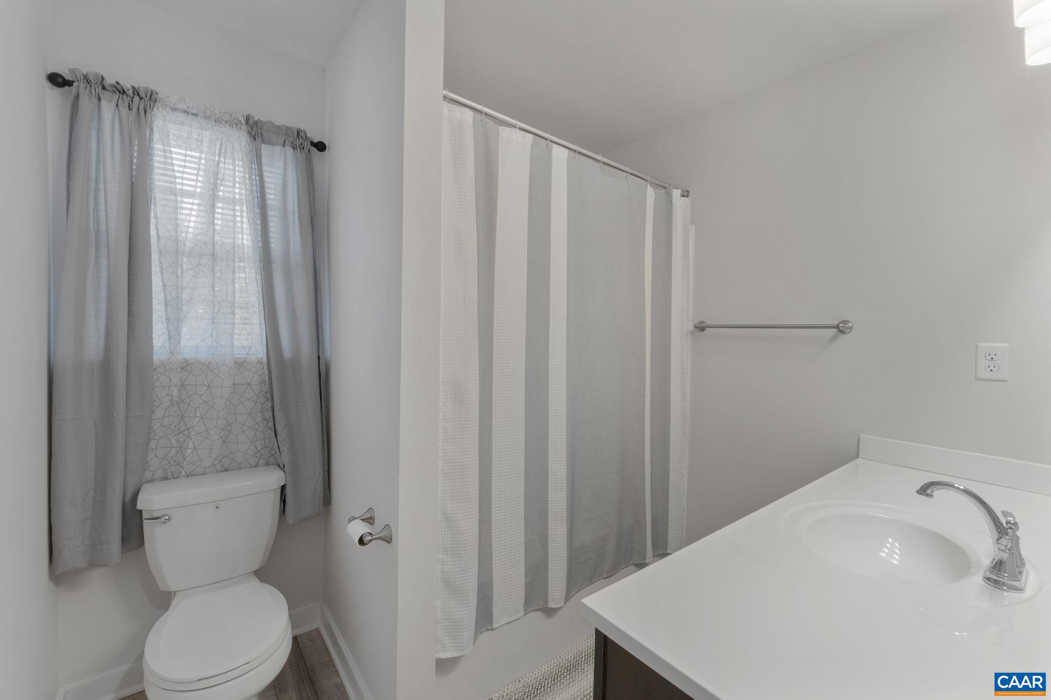 7440 Louisa Road Gordonsville, VA 22942 - Photo 30 of 40 a bathroom with a sink a toilet and shower