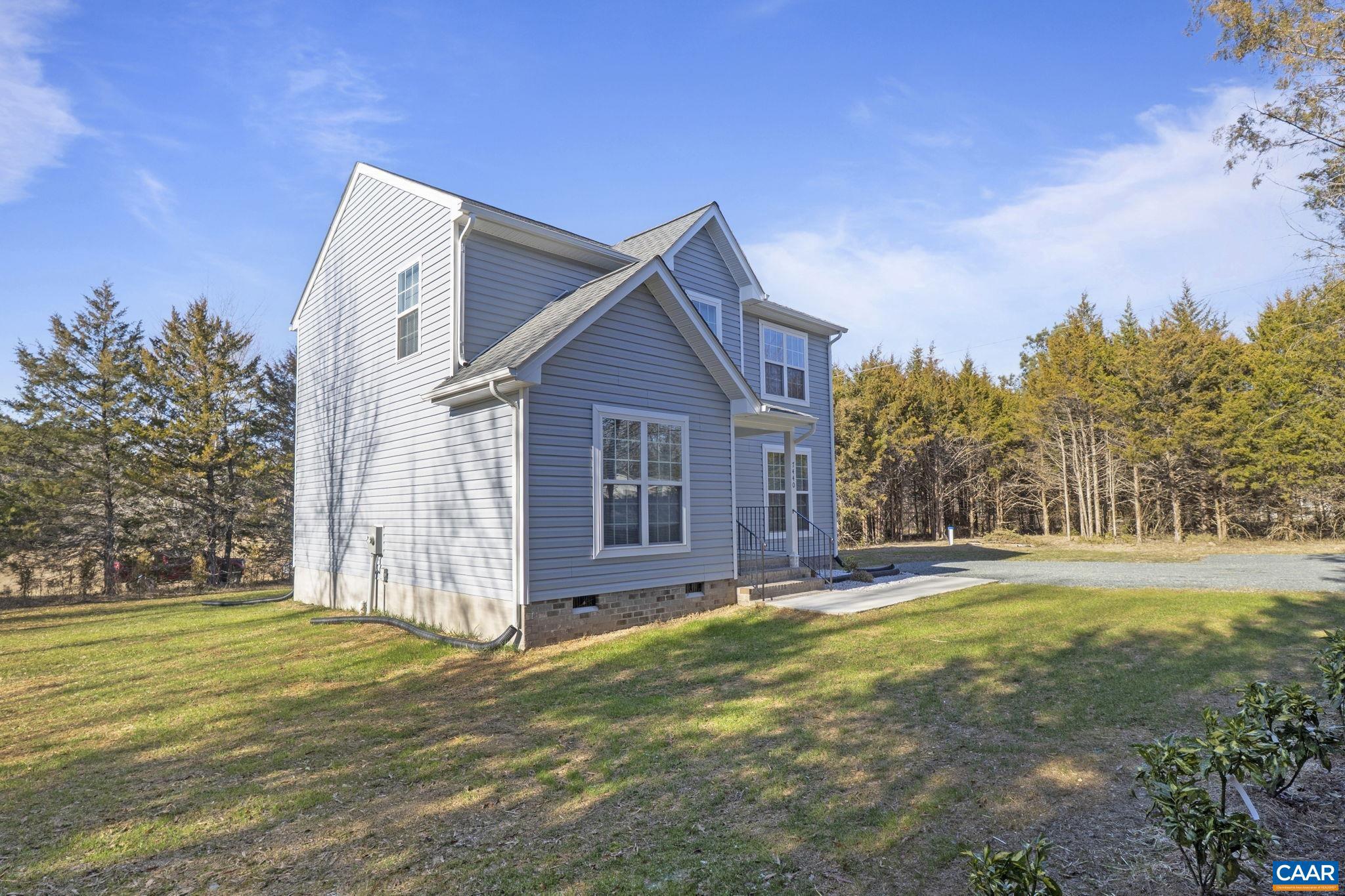 7440 Louisa Road Gordonsville, VA 22942 - Photo 35 of 40 a view of a house with a yard