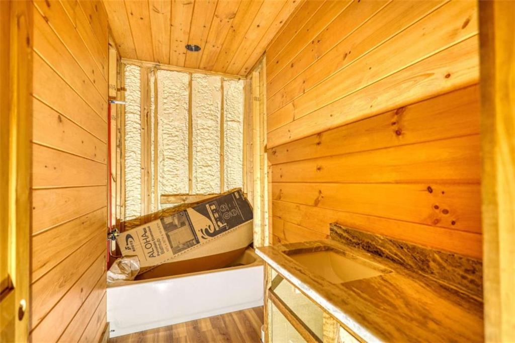 485 Church Street Blue Ridge, GA 30513 - Photo 19 of 85 a bathroom with a bathtub and next to a window