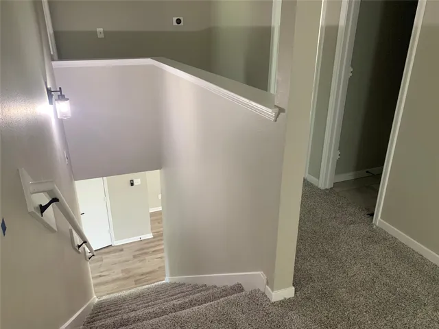 a view of a hallway with windows