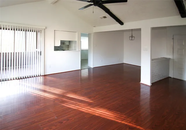 a view of a livingroom with wooden floor