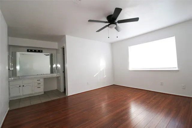 a view of a kitchen with a dishwasher cabinets and a window