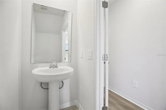 a bathroom with a sink and a mirror