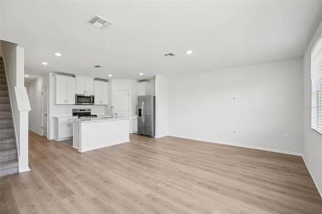 a view of kitchen with wooden floor