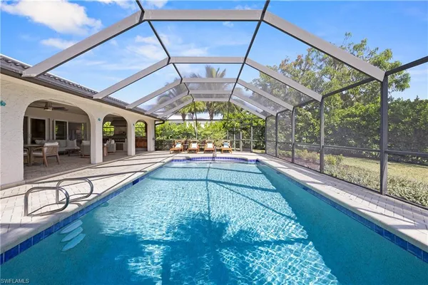 a view of a swimming pool with a porch