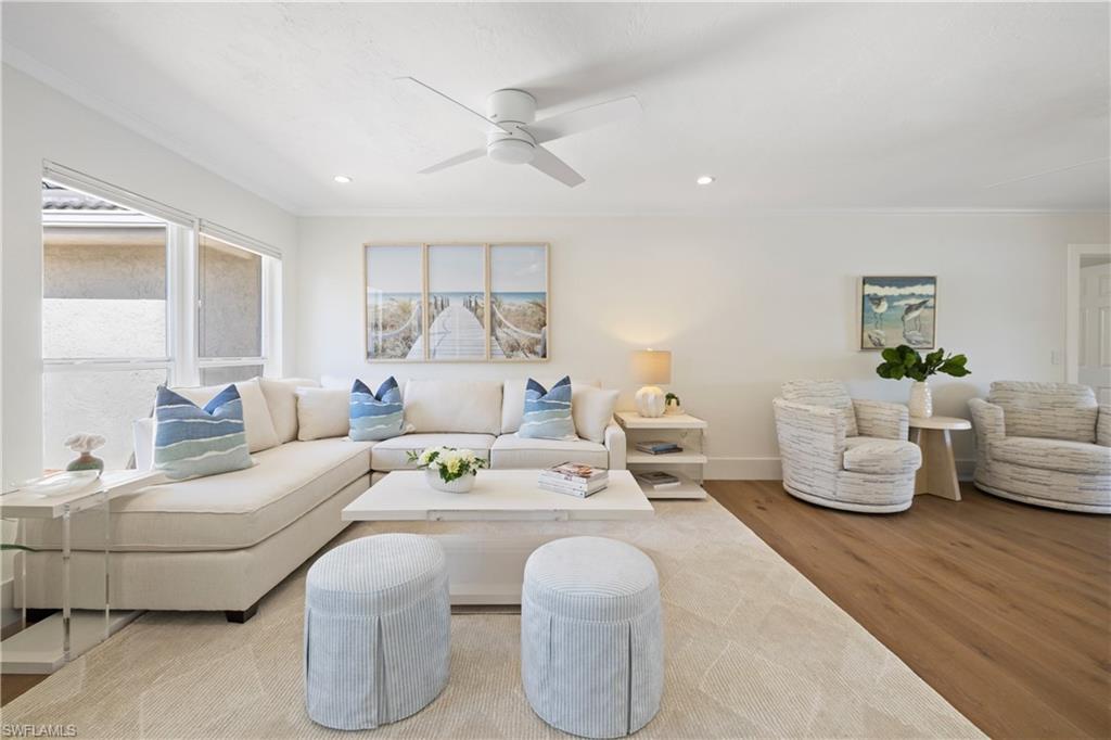 4916 Crayton Road Naples, FL 34103 - Photo 11 of 34 a living room with furniture and a large window