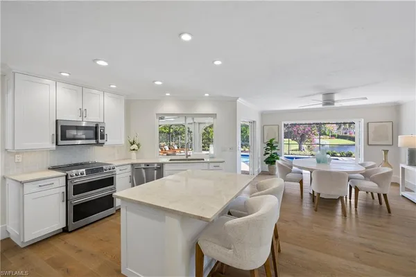a kitchen with a table and chairs