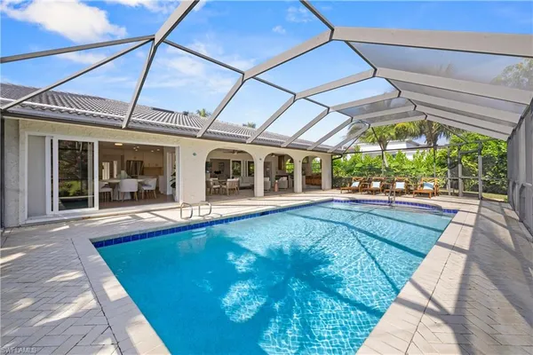 a living room with furniture a fireplace and a table