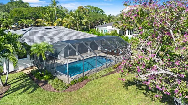 a view of a lake with a yard