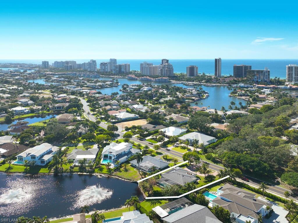 4916 Crayton Road Naples, FL 34103 - Photo 34 of 34 a view of a city with tall buildings