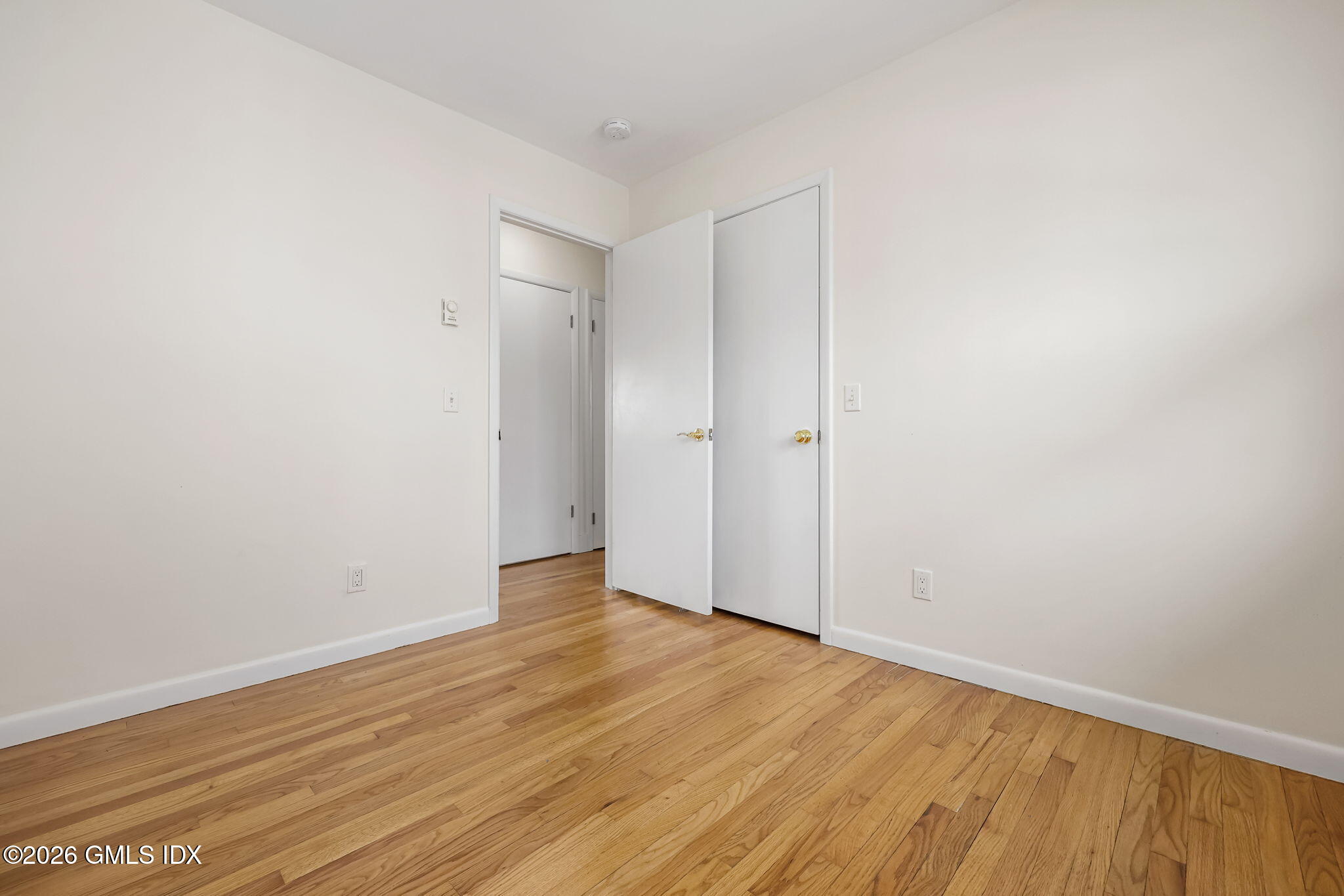 2 Grange Street Greenwich, CT 06830 - Photo 8 of 31 a view of an empty room with wooden floor