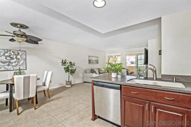 a dining room with table chairs and a window