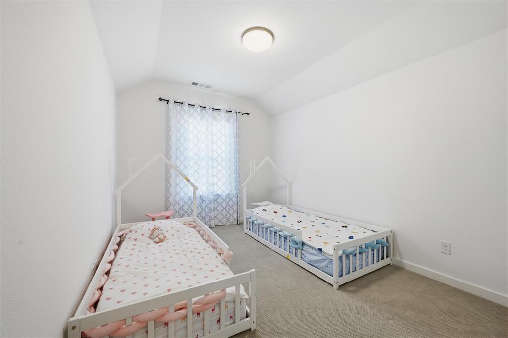 2416 Gallions Road Celina, TX 75009 - Photo 14 of 33 a bedroom with bed and a window