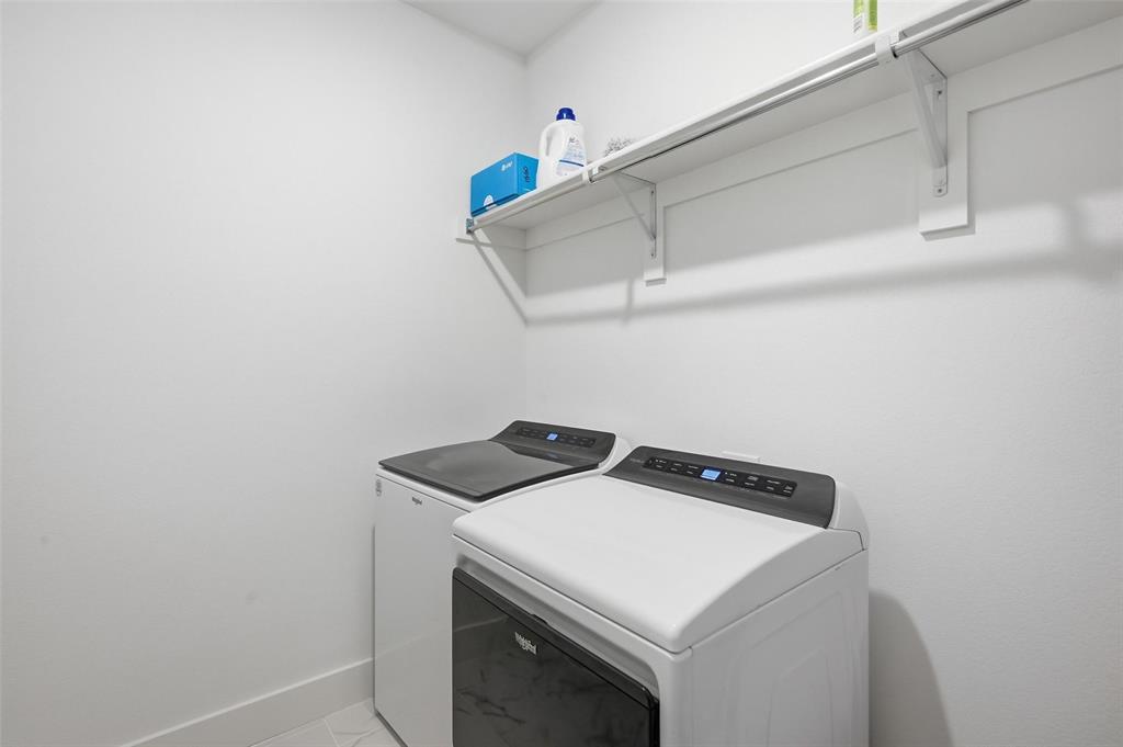 2416 Gallions Road Celina, TX 75009 - Photo 18 of 33 a utility room with dryer and washer