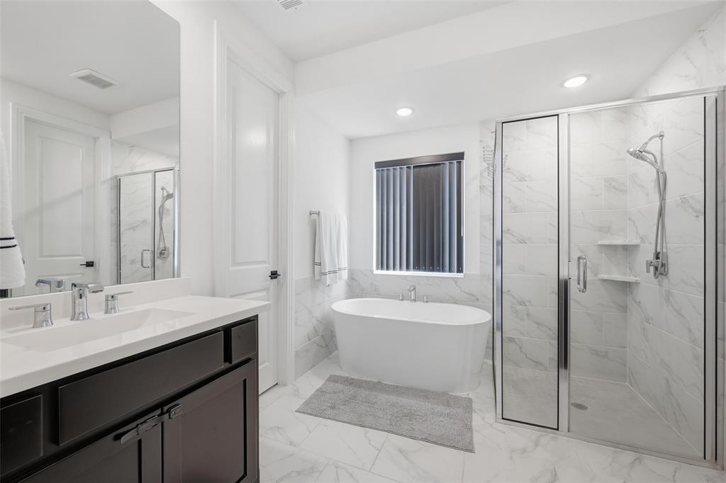 2416 Gallions Road Celina, TX 75009 - Photo 10 of 33 a bathroom with a sink a toilet and shower