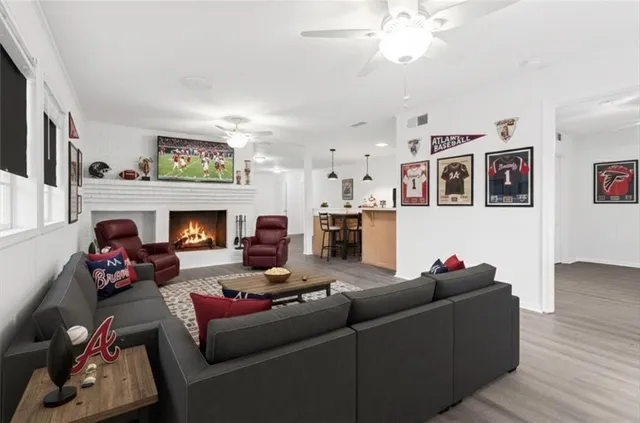 a living room with furniture and a fireplace