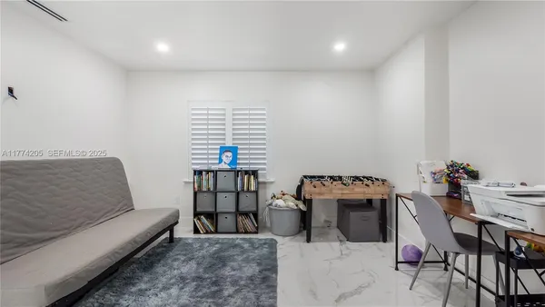 a bathroom with a shower curtain mirror and toilet