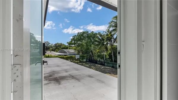 a spacious bedroom with a bed and a shower