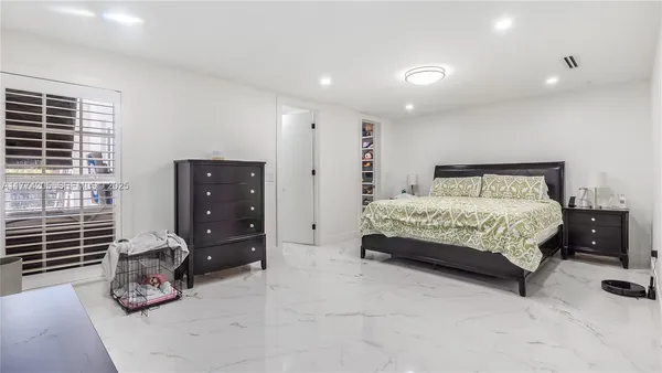 a bathroom with a bathtub shower sink mirror and toilet