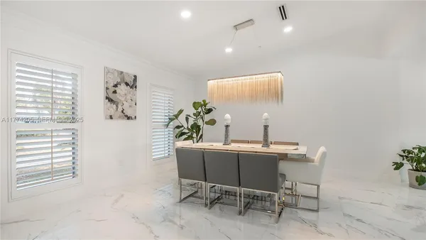 a kitchen with a sink and center island