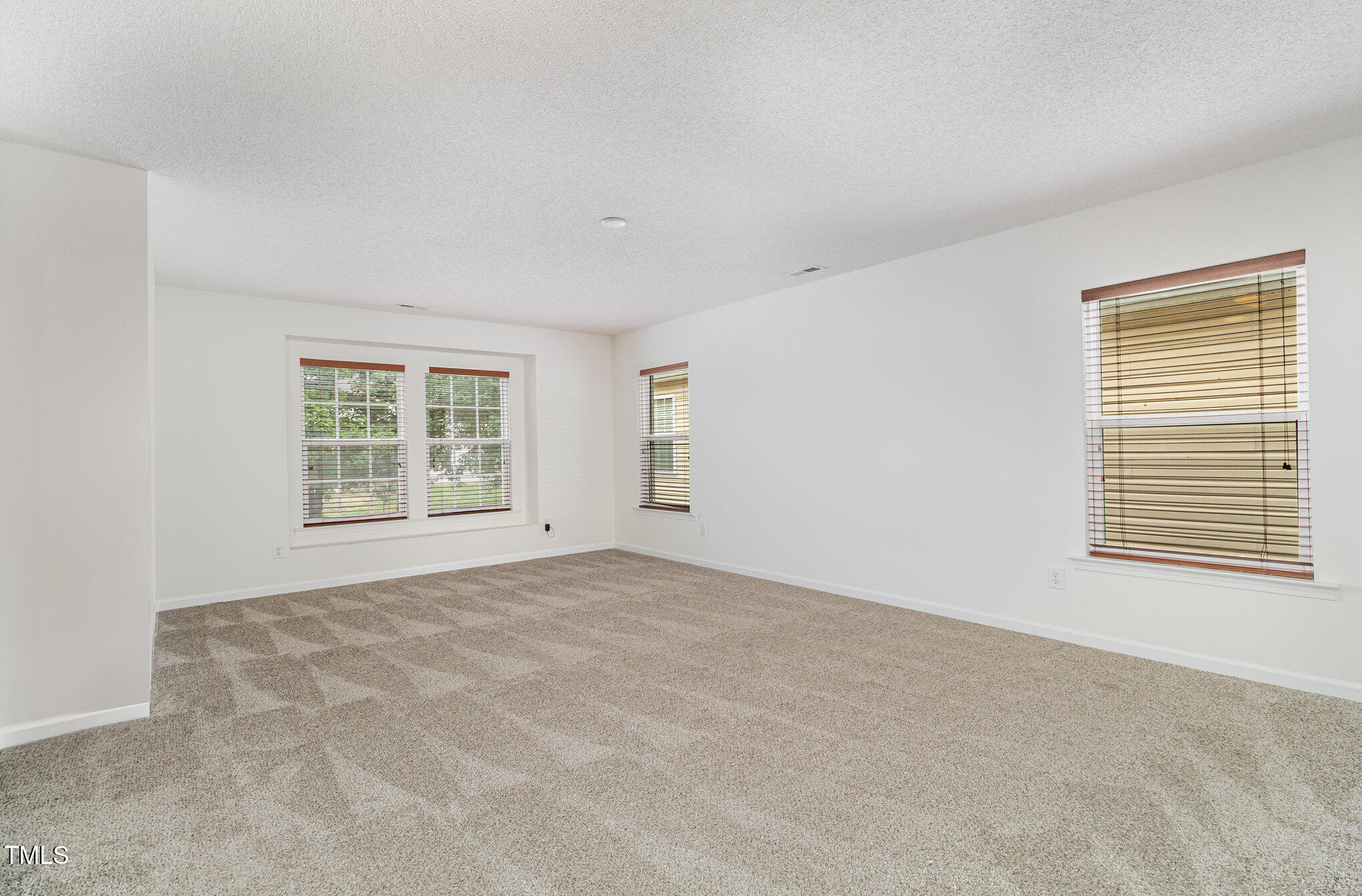 5404 Meryton Park Way Raleigh, NC 27616 - Photo 17 of 35 an empty room with a window
