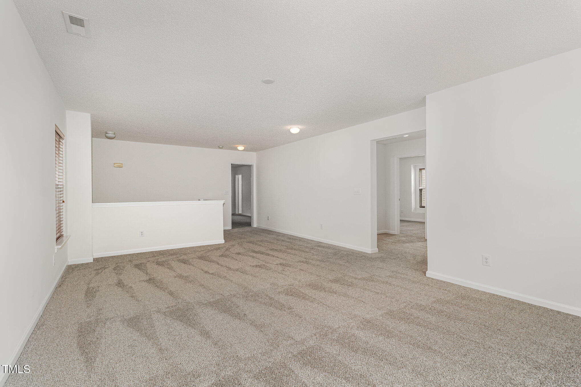 5404 Meryton Park Way Raleigh, NC 27616 - Photo 18 of 35 a view of an empty room
