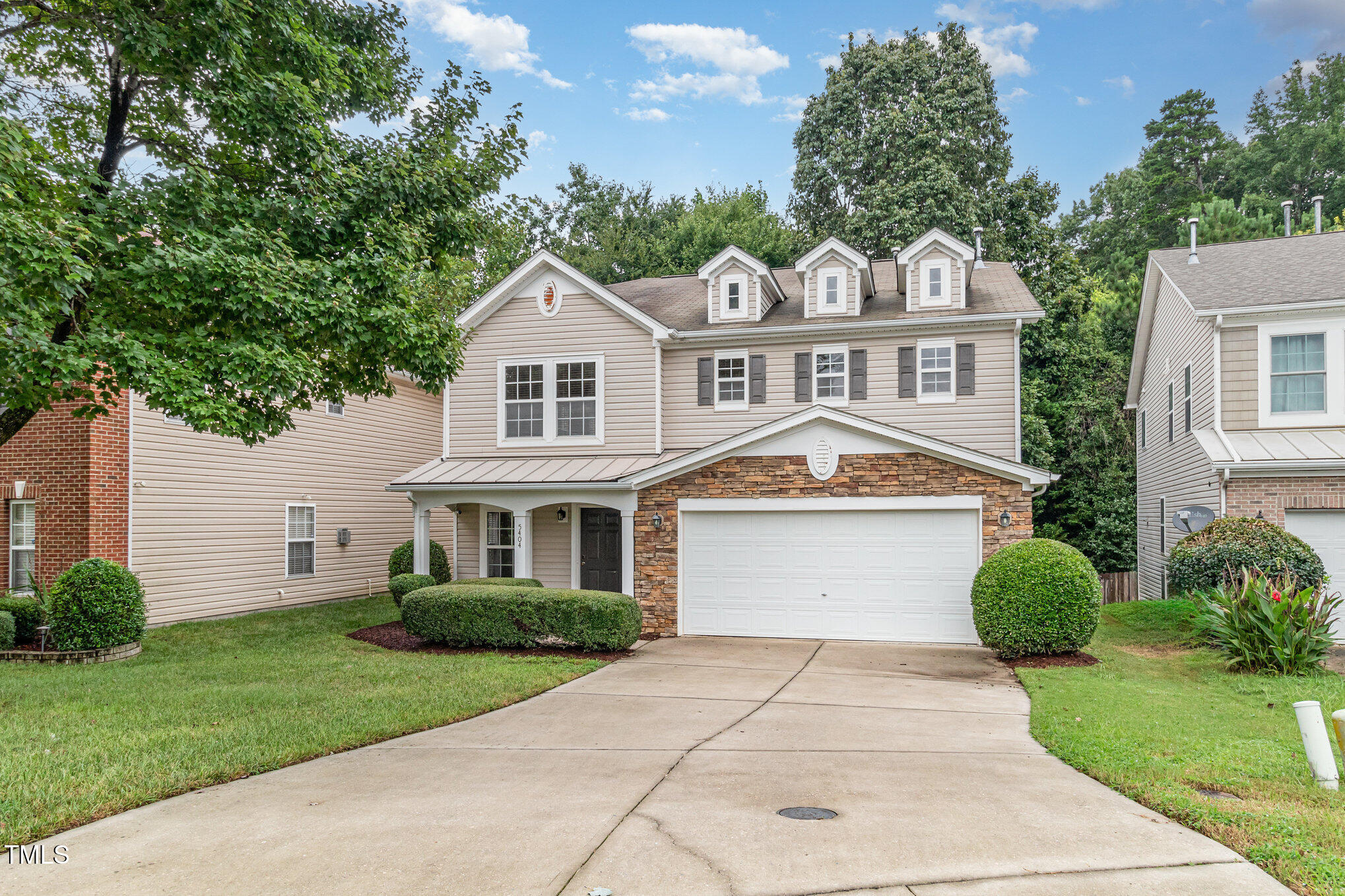 5404 Meryton Park Way Raleigh, NC 27616 - Photo 2 of 35 a front view of a house with garden