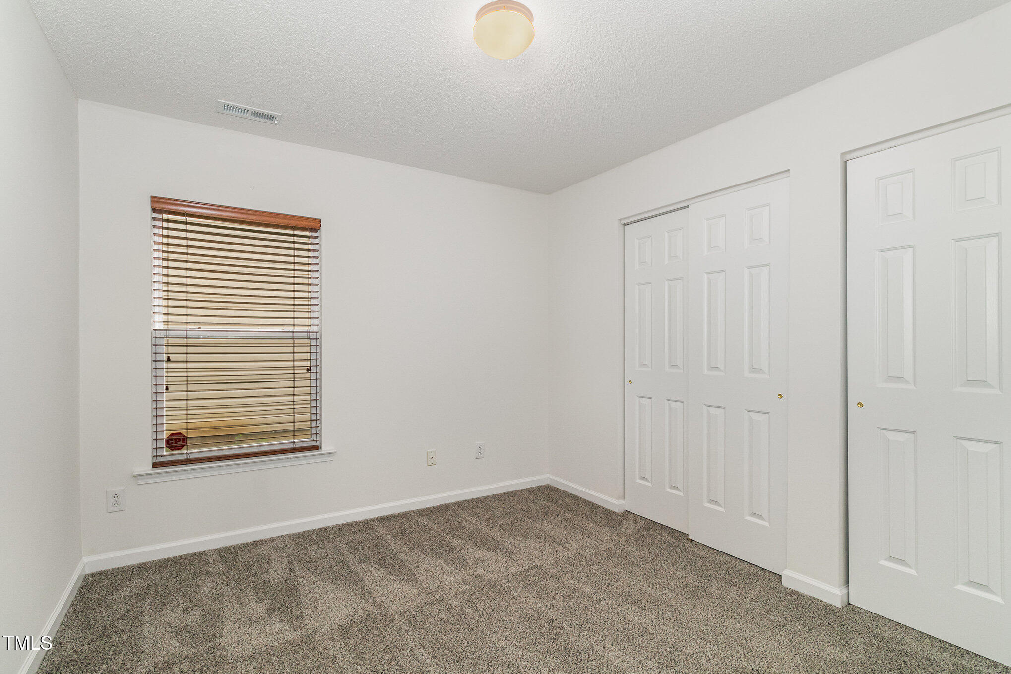 5404 Meryton Park Way Raleigh, NC 27616 - Photo 25 of 35 a view of an empty room with a window