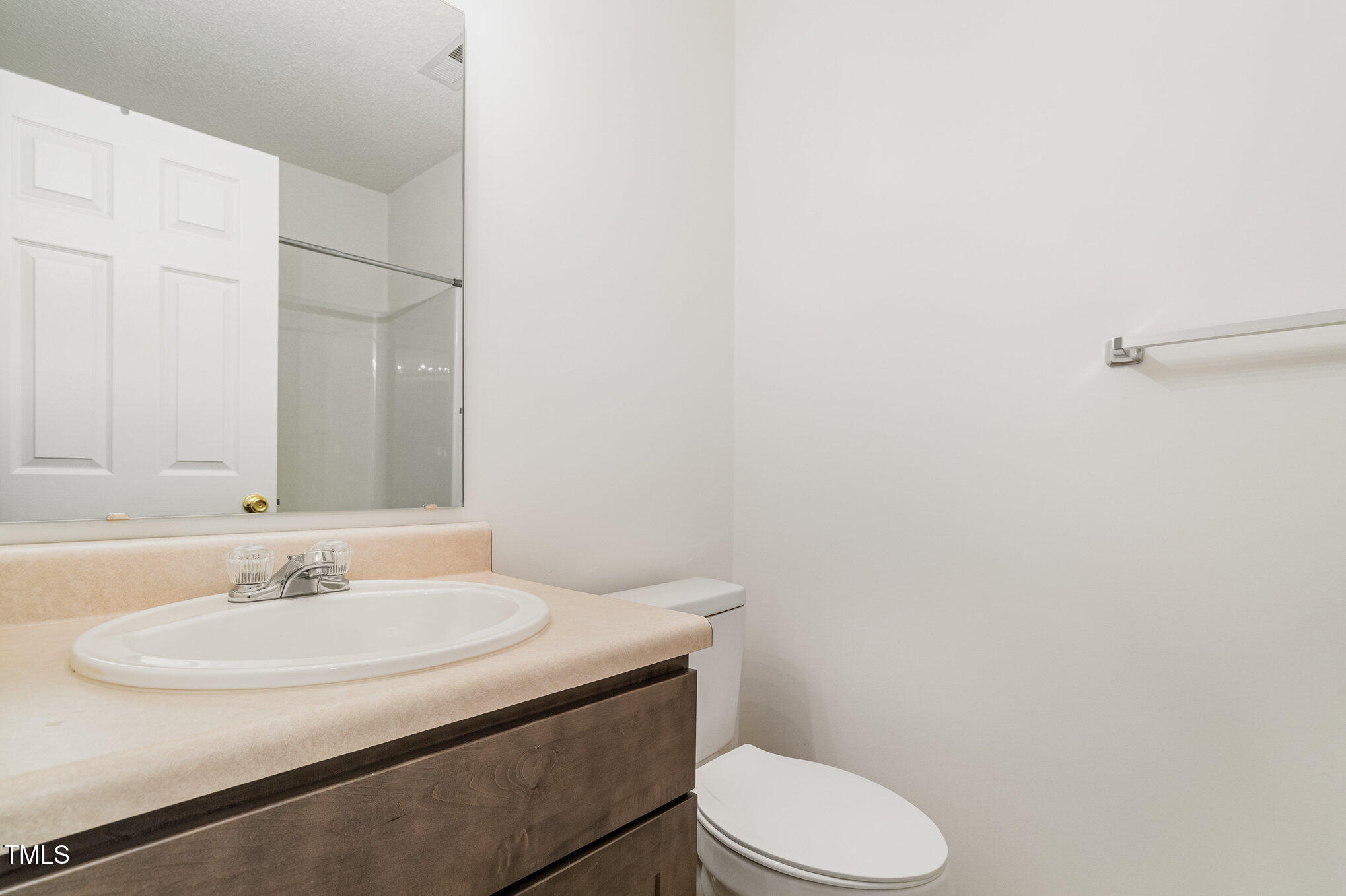 5404 Meryton Park Way Raleigh, NC 27616 - Photo 27 of 35 a bathroom with a sink toilet and a mirror
