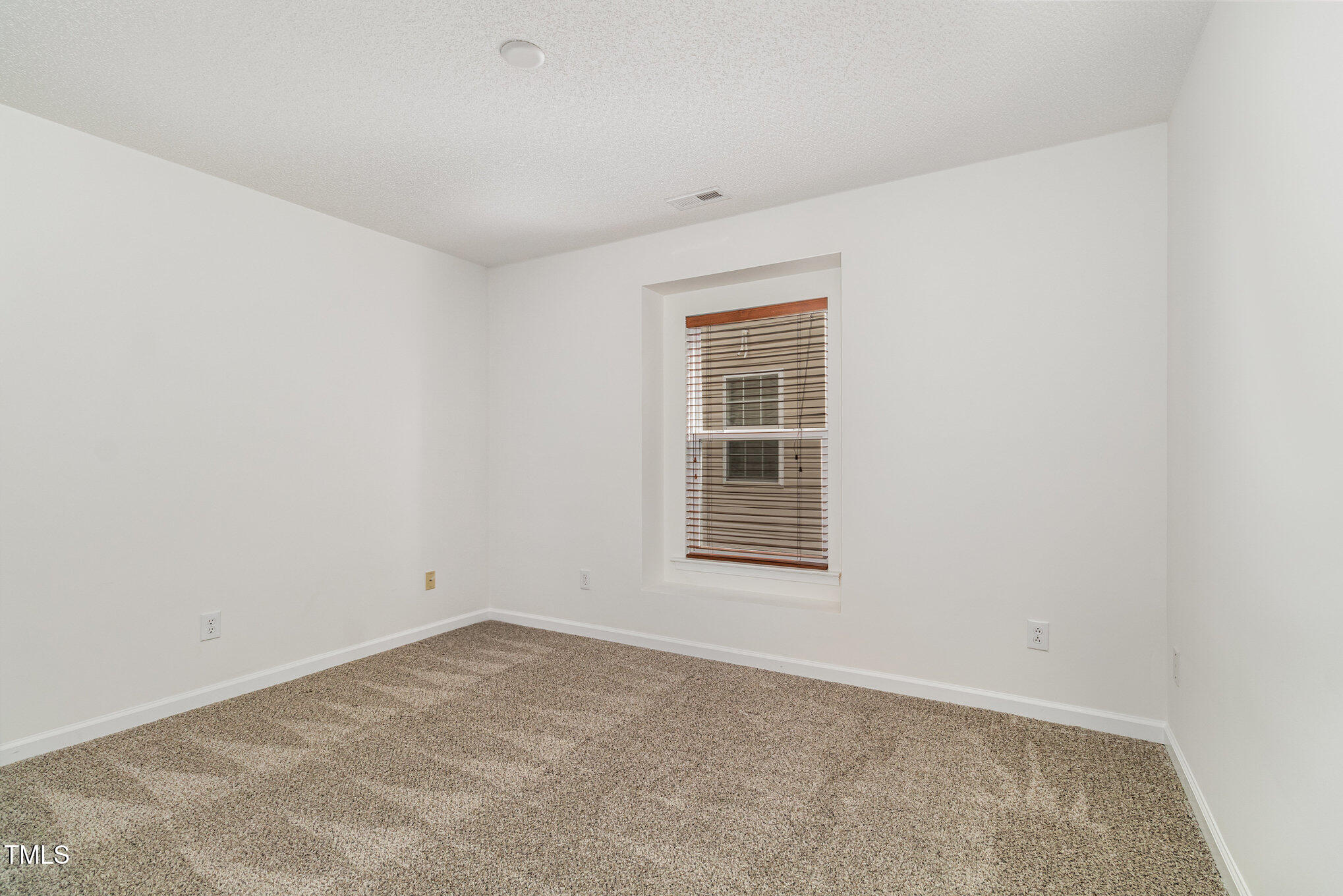 5404 Meryton Park Way Raleigh, NC 27616 - Photo 28 of 35 an empty room with a window
