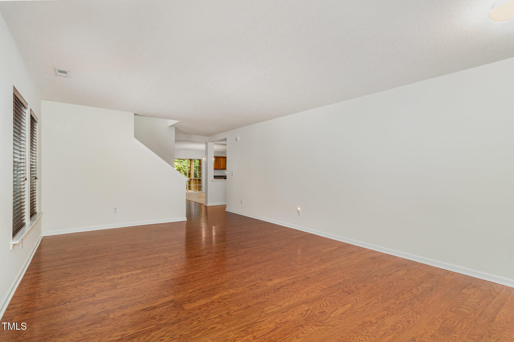 5404 Meryton Park Way Raleigh, NC 27616 - Photo 7 of 35 a view of empty room with wooden floor