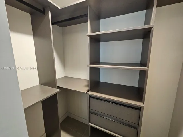 a bathroom with a double vanity sink toilet and a mirror