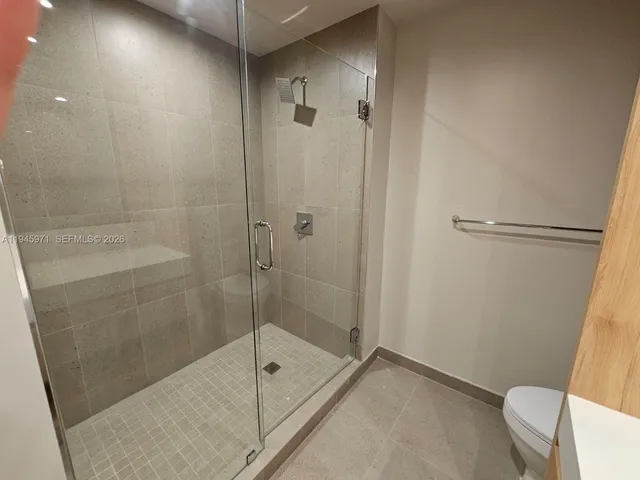 a view of a patio with table and chairs with wooden floor and fence