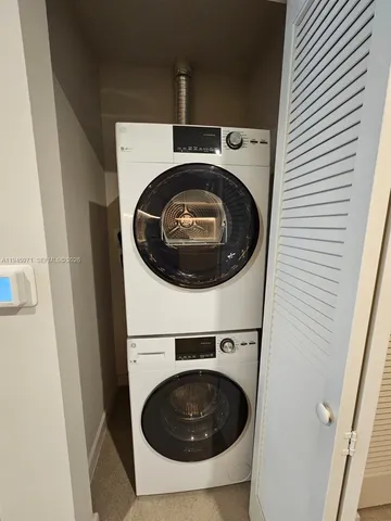 a dining room with furniture and a window
