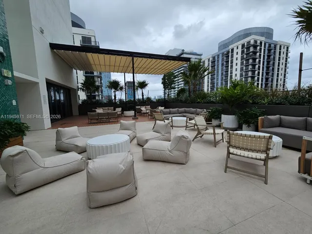 a outdoor space with patio furniture and potted plants