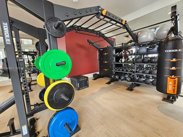 a lobby with furniture and floor to ceiling window