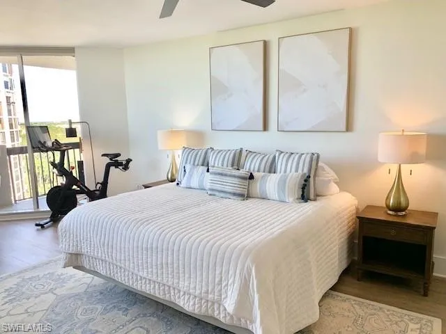 a bedroom with a bed and a lamp