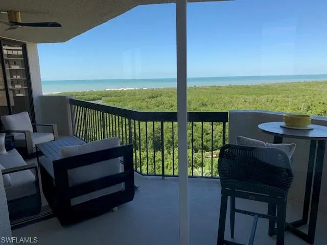 a view of a balcony with furniture