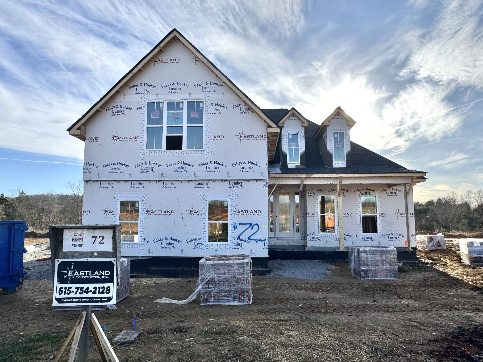2752 Jasmine Street, Unit 72 Lebanon, TN 37087 - Photo 1 of 1 a view of a grey house with large trees and wooden fence