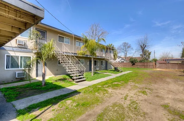 a view of a house with a yard porch and sitting area