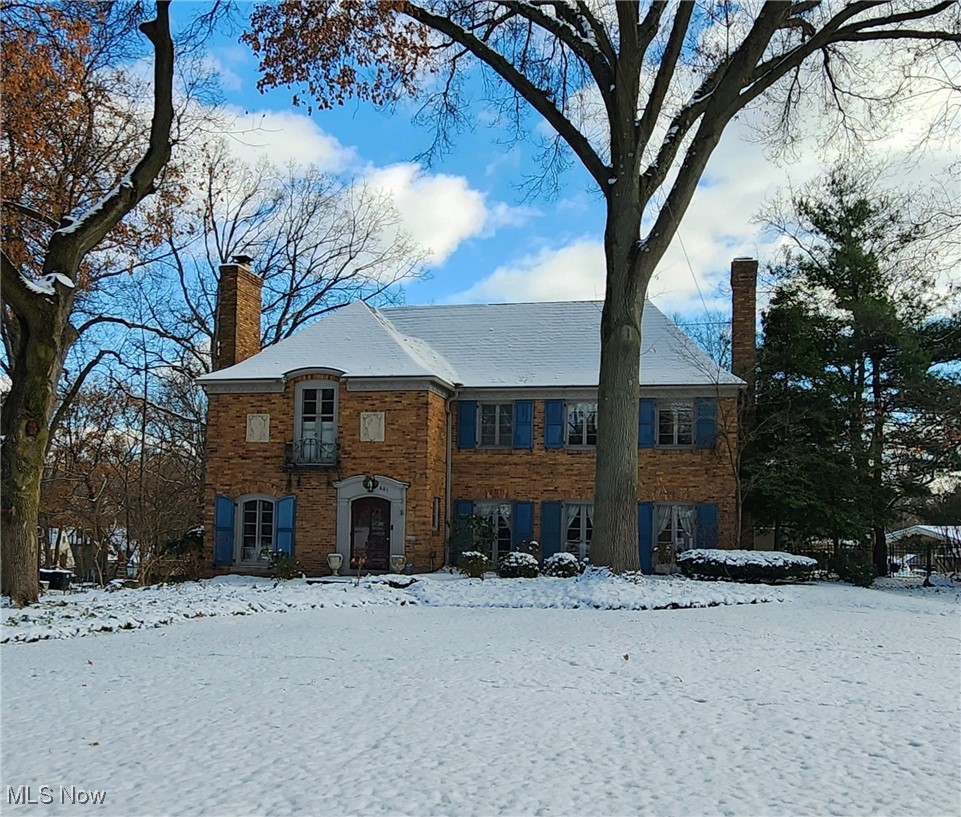 681 Merriman Road Akron, OH 44303 - Photo 1 of 43 View of the front of this spectacular, custom built home. Notice the two chimneys, with three fireplaces. One on the left side of the home and stacked on two levels on the right side of the home. The snow is covering a beautiful slate roof. Nicely landscaped.