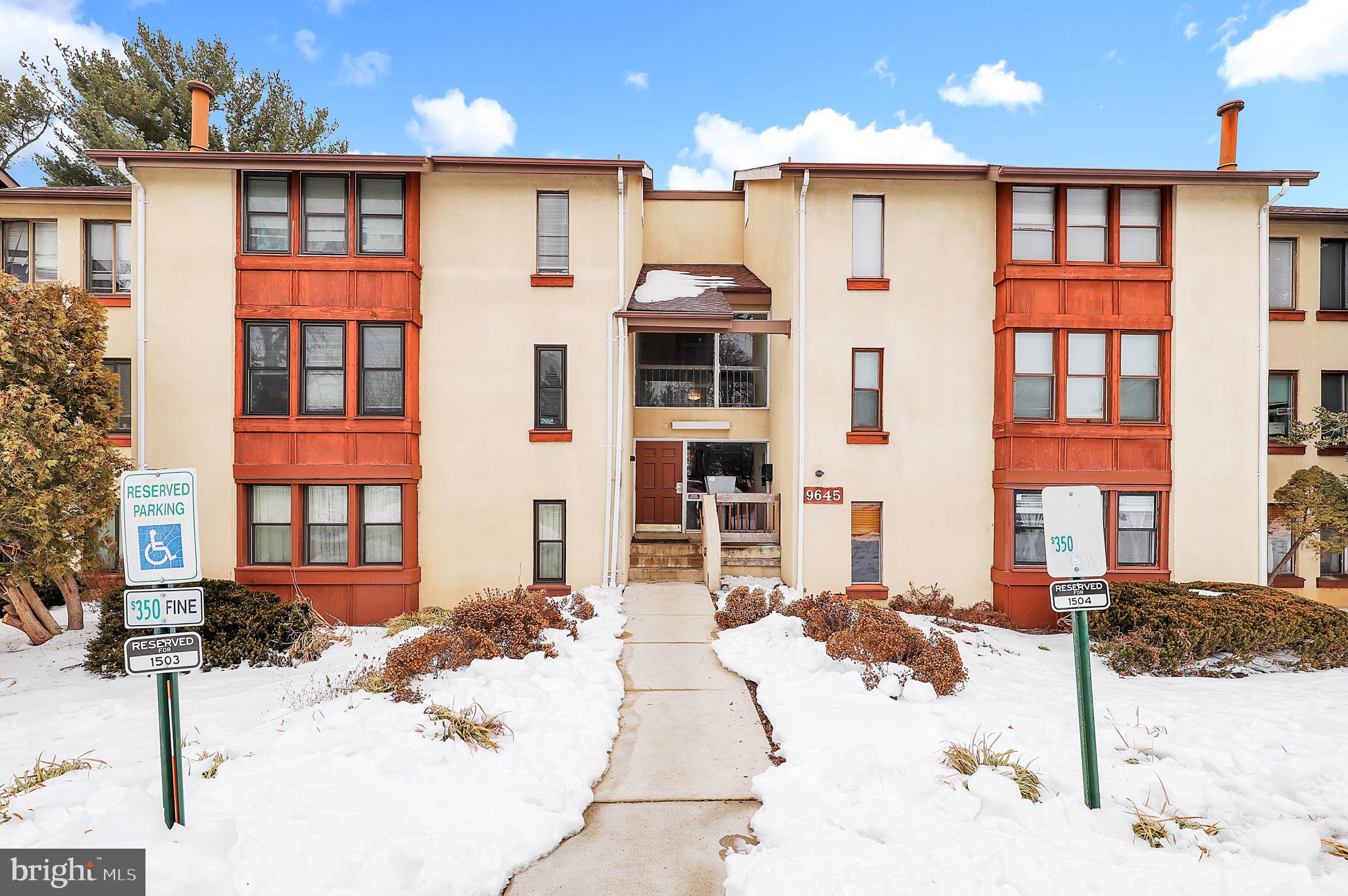 a view of a brick building with many windows