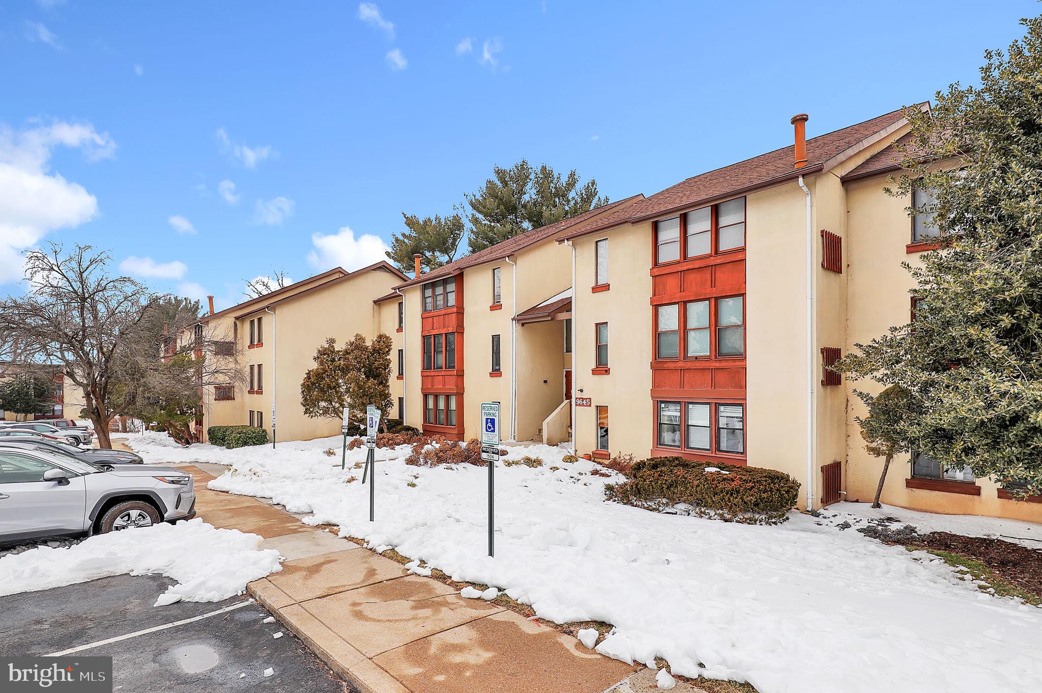 9645 White Acre Road, Unit A2 Columbia, MD 21045 - Photo 2 of 25 a view of a building with a snow