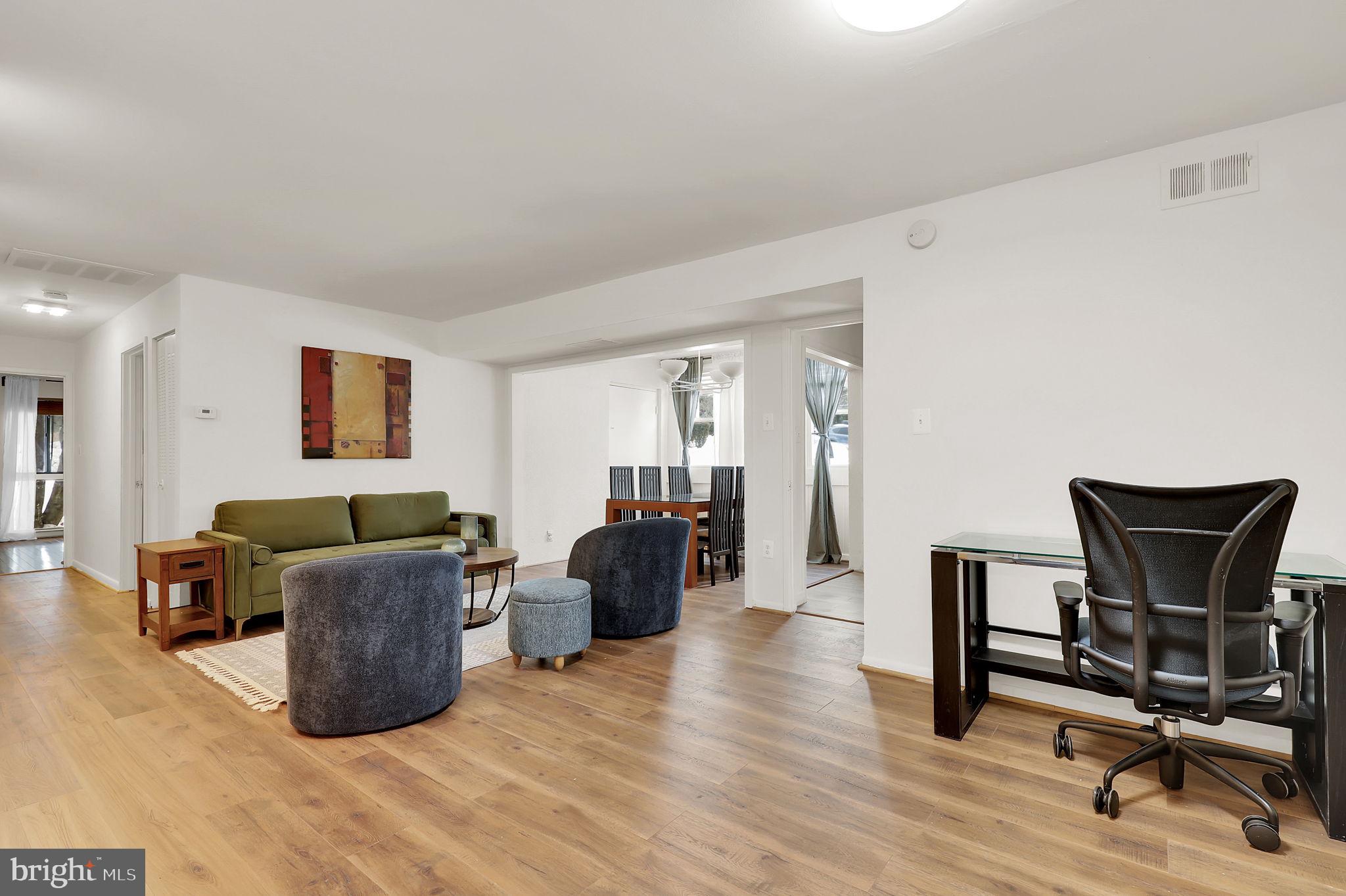 9645 White Acre Road, Unit A2 Columbia, MD 21045 - Photo 5 of 25 a work room with furniture and wooden floor