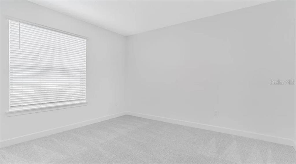 899 Arbor Grn Trail St. Cloud, FL 34771 - Photo 21 of 34 an empty room with a window
