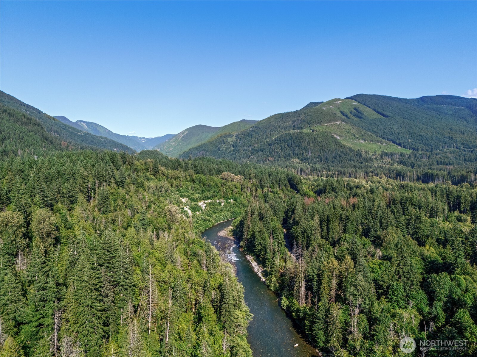 76011 Northeast 123rd Street Skykomish, WA 98288 - Photo 15 of 29 a view of a mountain range with lush green forest