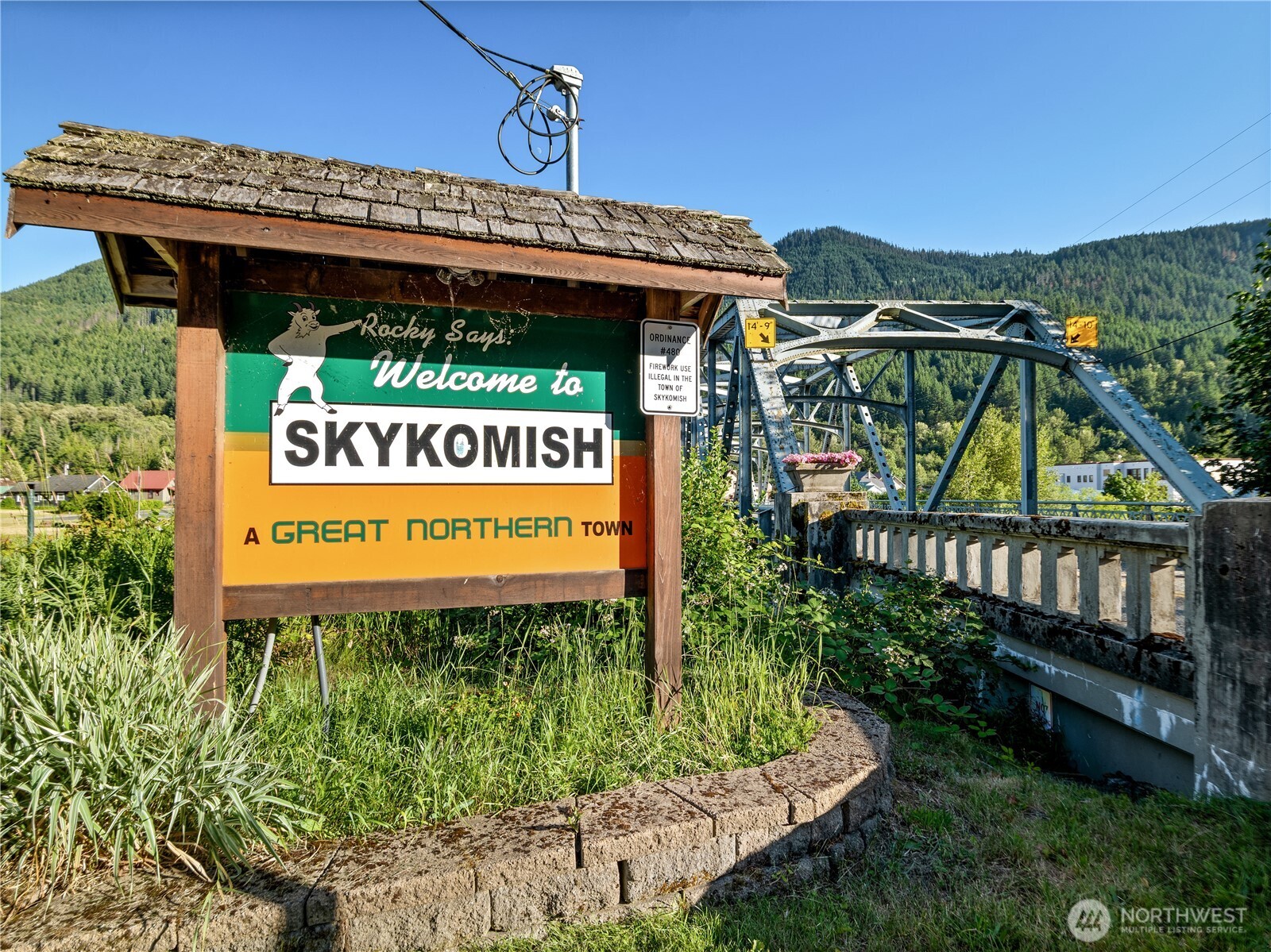 76011 Northeast 123rd Street Skykomish, WA 98288 - Photo 19 of 29 a sign on the side of the building