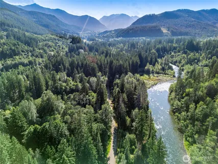 a view of a large mountain with a mountain in the background